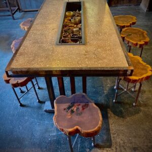 Concrete table with wood stools