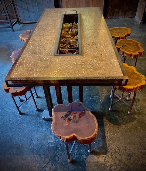 Concrete table with wood stools